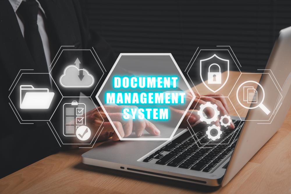 Businessman using laptop for online document management