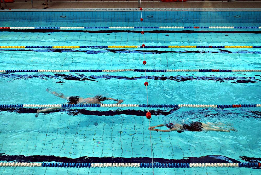 Individuals enjoying an indoor swimming session at Kaplen JCC
