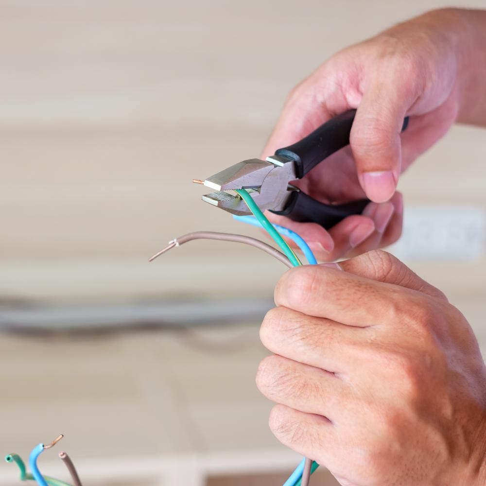 Electrical contractor installing complex wiring solutions