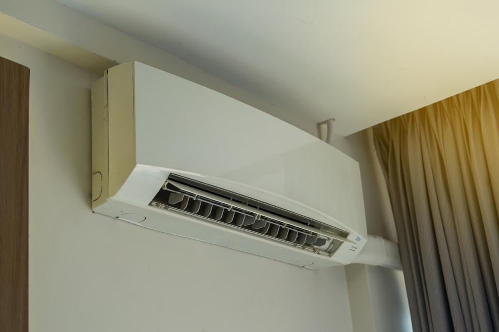 Skilled Technician Installing Ductless AC in San Antonio Home