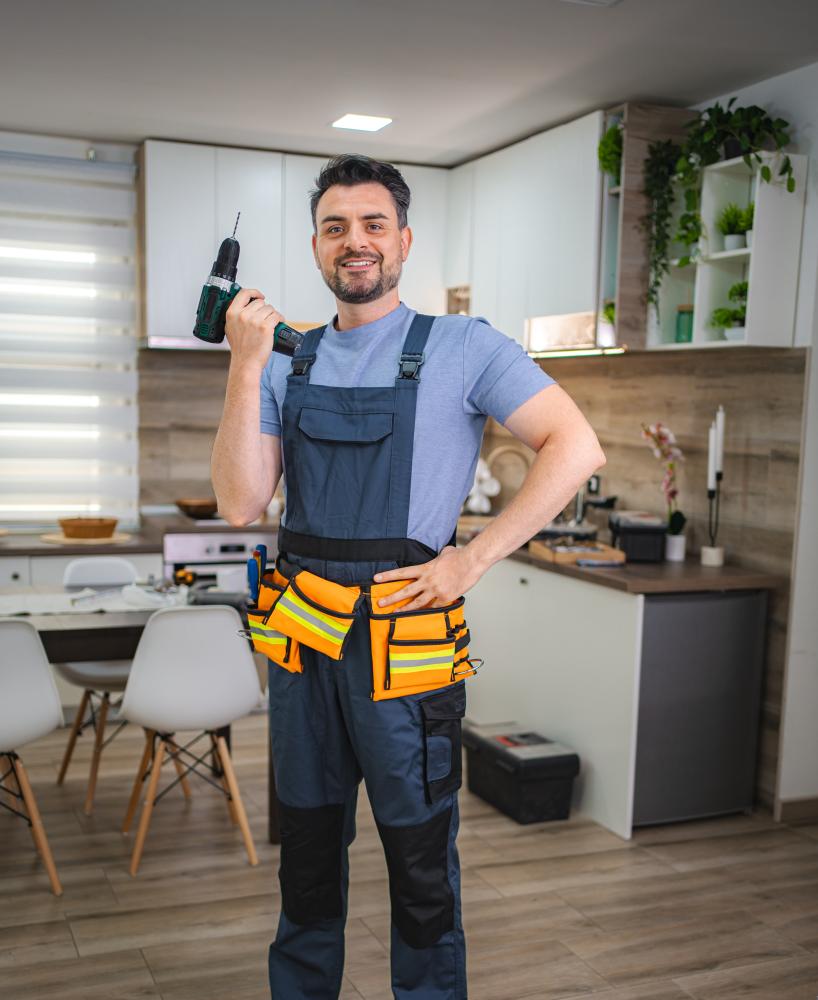 vecteezy handyman holding cordless drill smiling at camera in kitchen 70531204 456