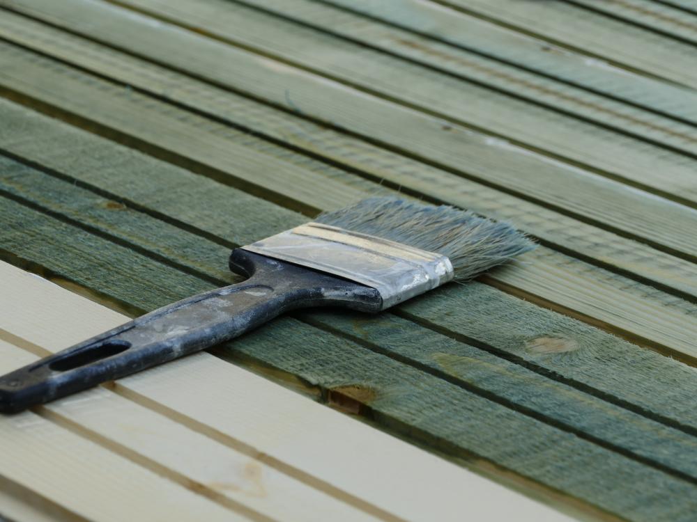 the process of deck staining and painting