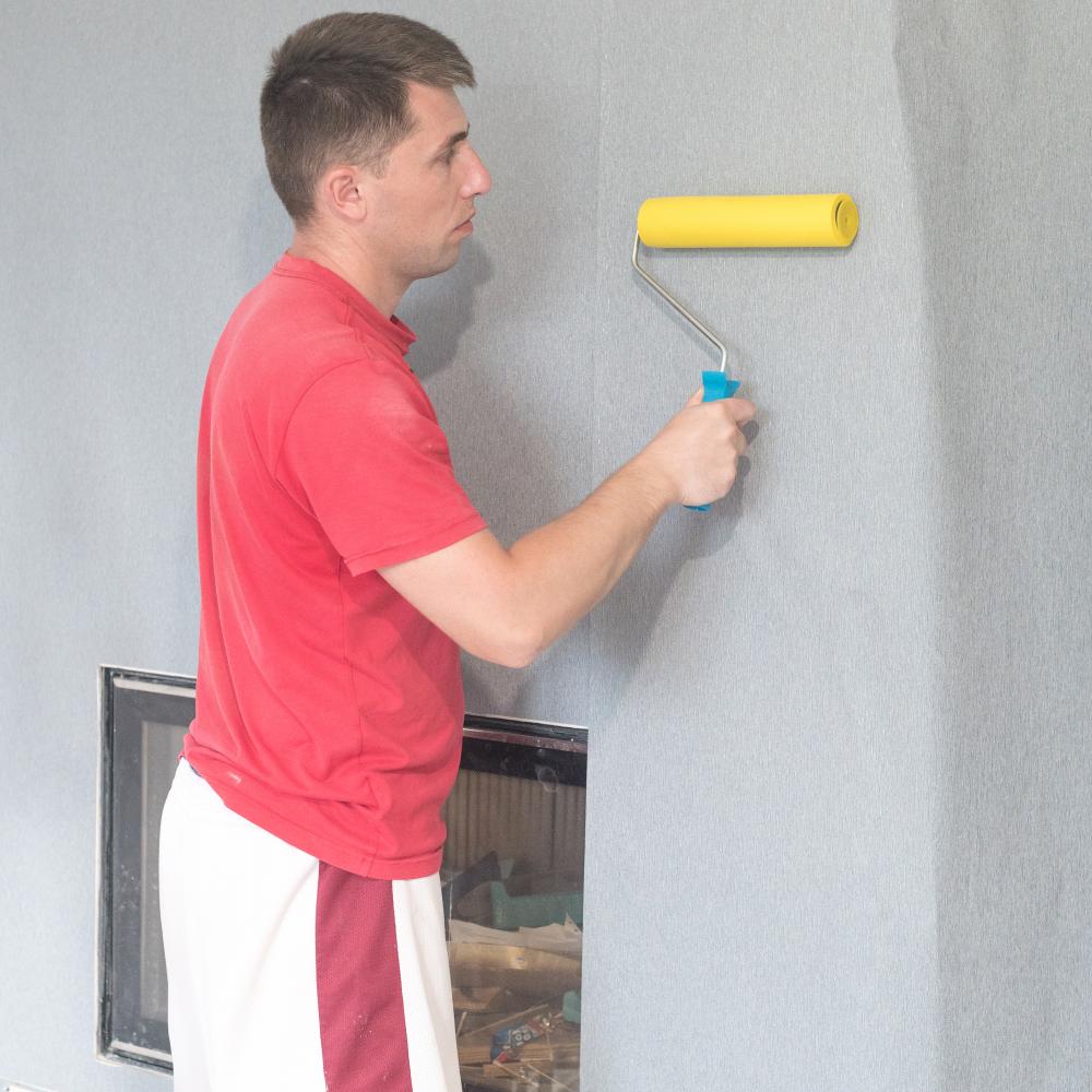 Skilled painter's meticulous attention to detail during room painting
