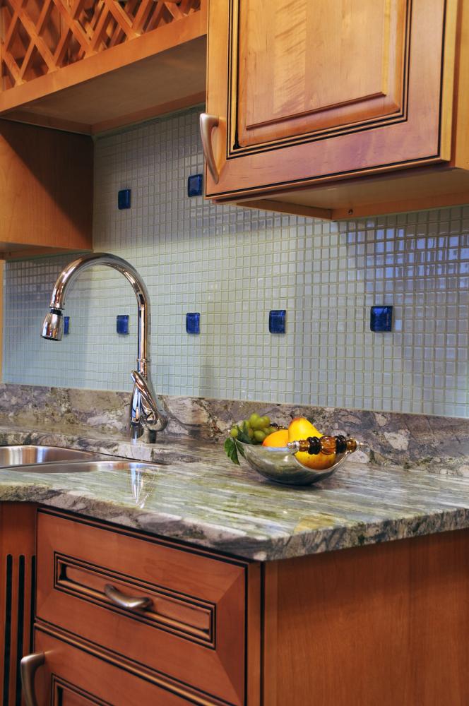 Breathtaking kitchen with backsplash designed by BRG Custom Stones