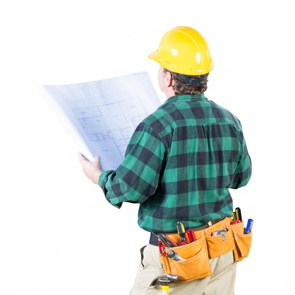 Professional contractor reviewing electrical plans for a project