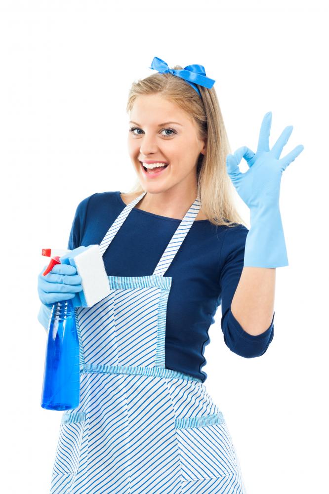 Satisfied cleaner showing OK sign after exceptional cleaning service