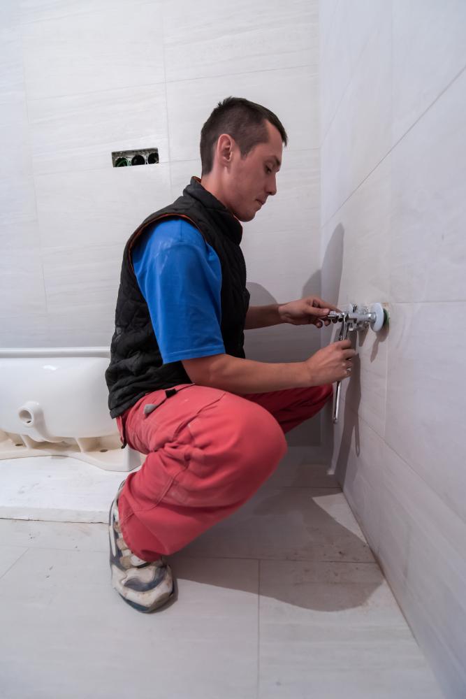 Dedicated plumber performing maintenance, ensuring Manassas plumbing longevity