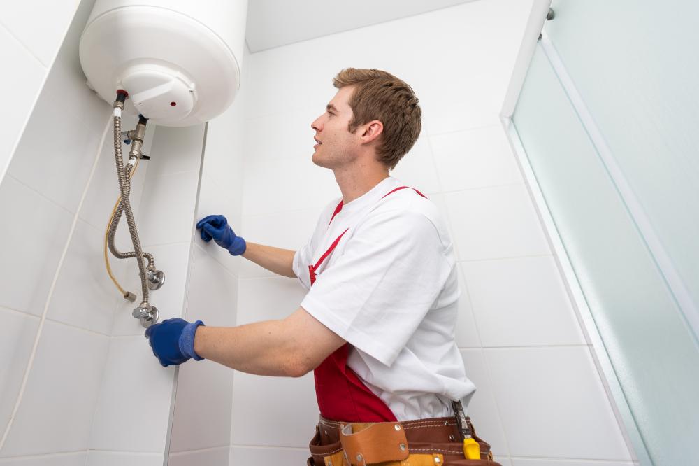 Expert plumber fixing a tankless water heater