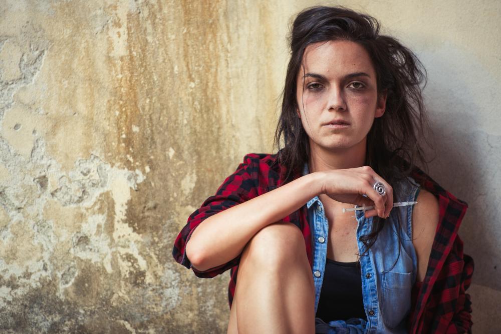 Young woman grappling with heroin addiction as a representation of teenage substance abuse