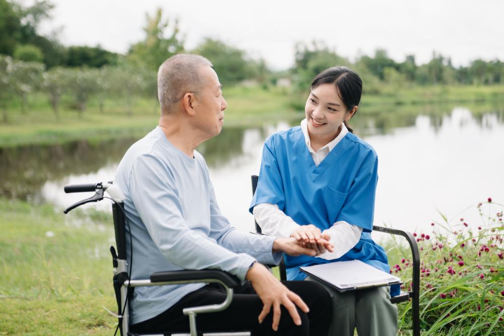Supportive caregiver with satisfied patient depicting outpatient rehab care in Thousand Oaks