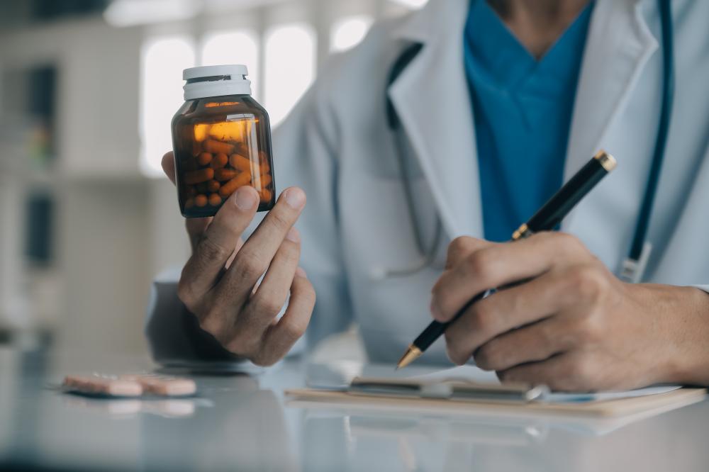 Experienced doctor embracing digital innovation in drug treatment