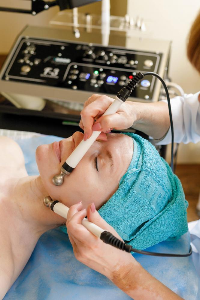 Cosmetologist performing Frequency Specific Microcurrent Therapy session in Calabasas