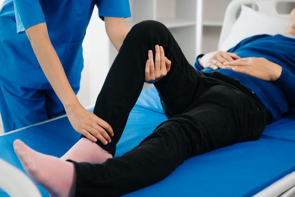 Patient consulting Calgary Physiotherapist for back problems
