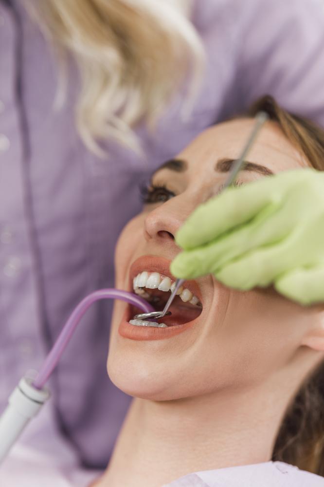 Periodontist performing a dental check-up representing Periodontics PA