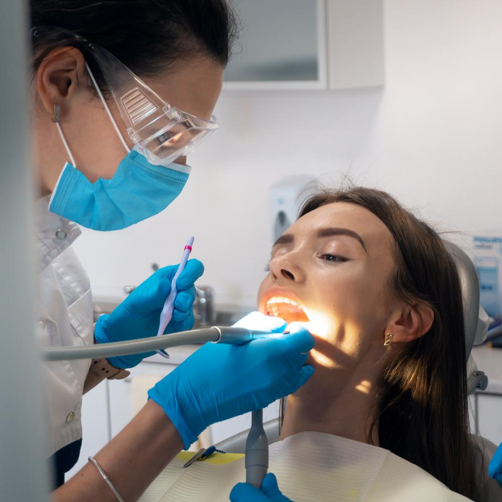 Patient receiving emergency dental care from skilled dentist