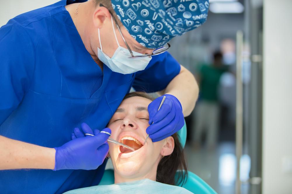 Dentist performing emergency dental procedure