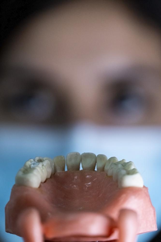 Patient receiving post-extraction care for dental health