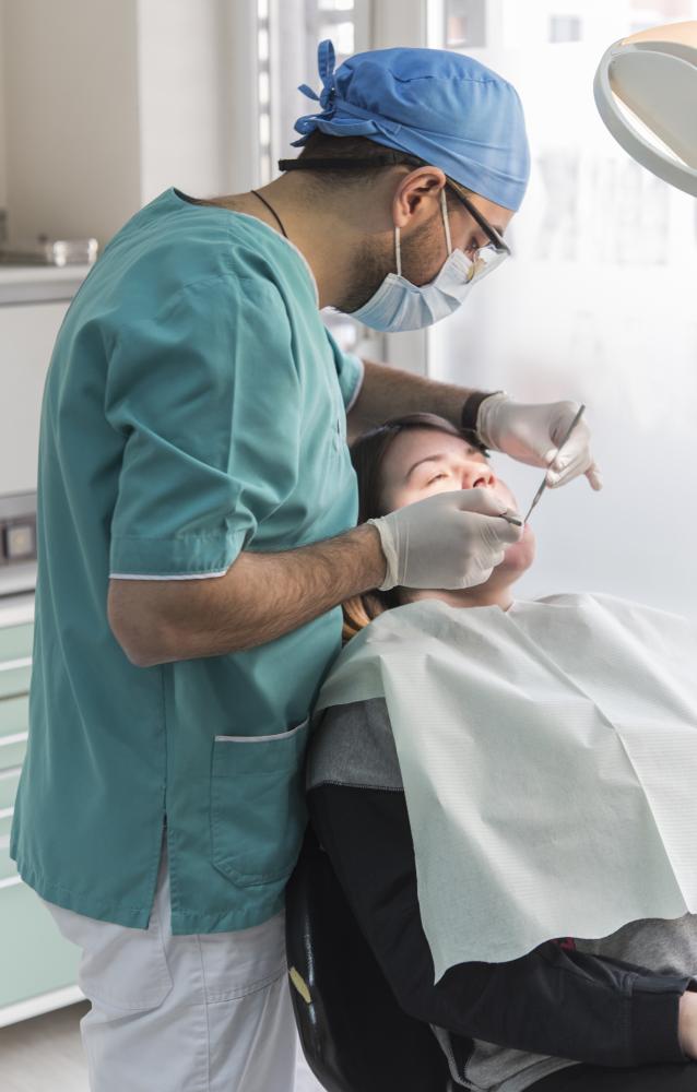 Dentist consulting with patient after emergency teeth pulling