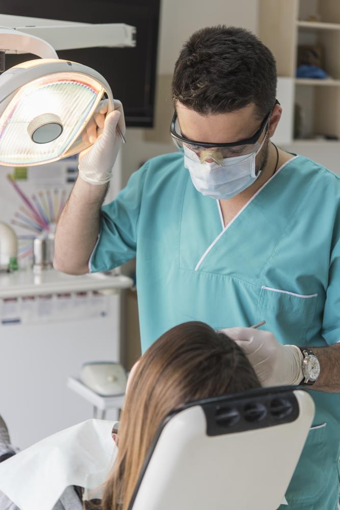 Dental team collaborates using advanced technology for patient care enhancement