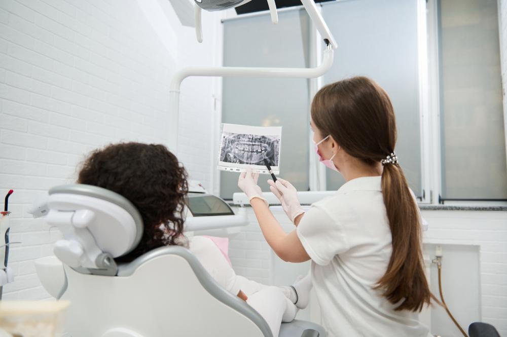 Dentist and patient discussing tailored dental treatment plans