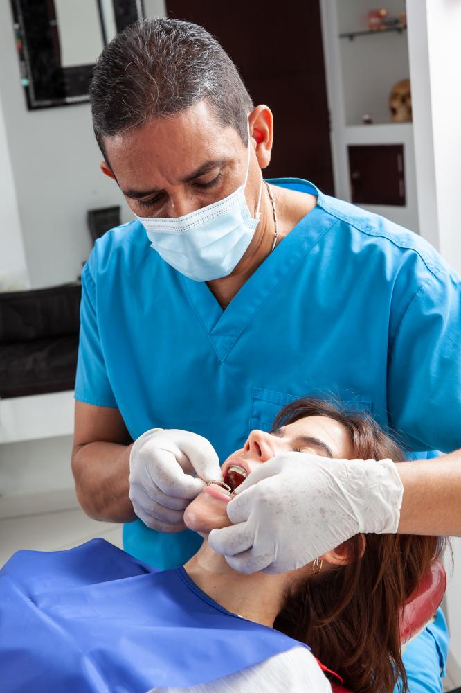 Dentist performing a tooth extraction with precision