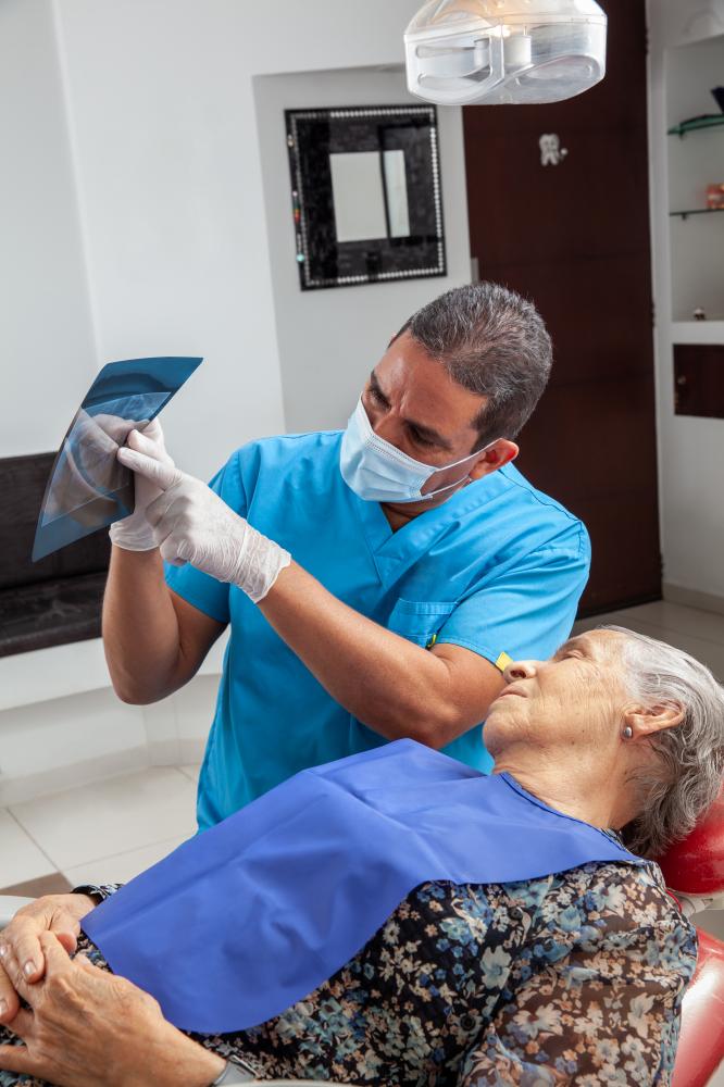Dentist showcasing post-extraction patient care