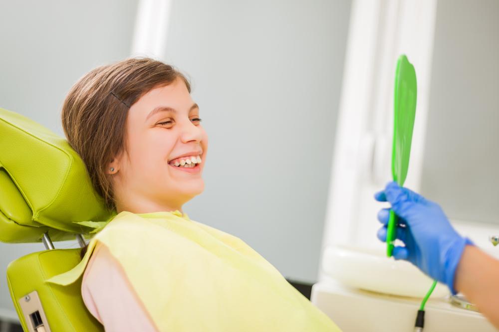 Orthodontist performing teeth cleaning procedure in Orlando
