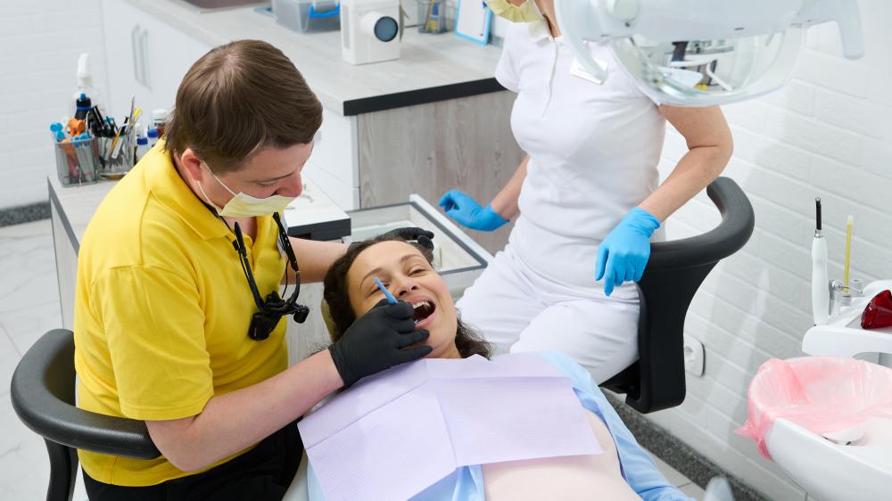 Dentist providing emergency dental treatment to a patient