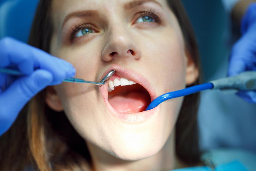 Dentist providing urgent dental care to alleviate patient's pain