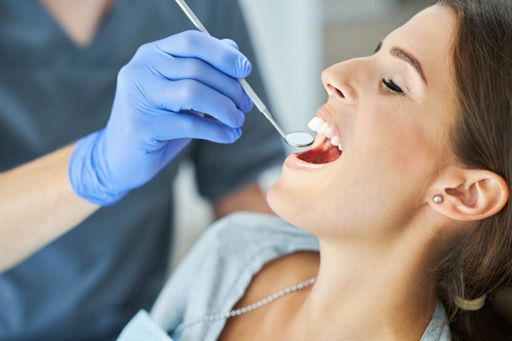 Dentist preparing for same-day dental extraction with ultraviolet light