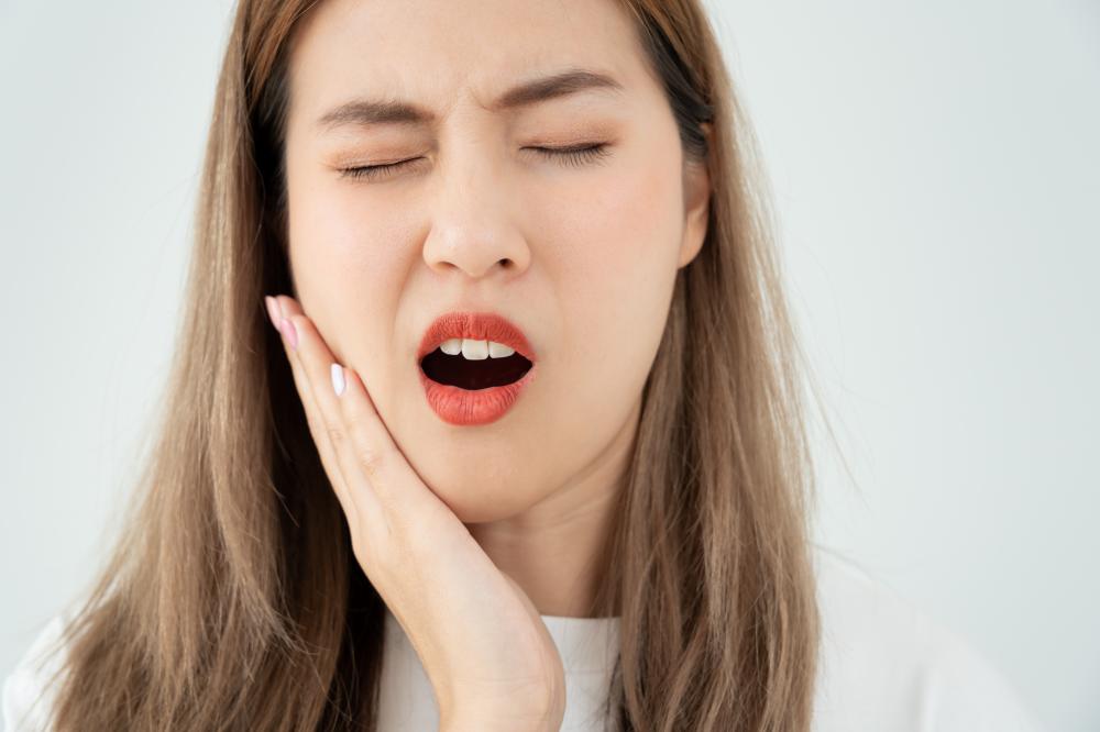 Woman in Toothache Emergency Needs Urgent Dental Care