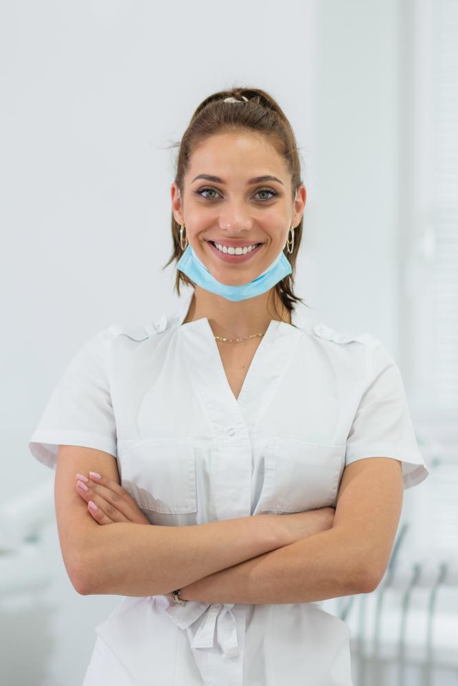 Dentist warmly greeting a patient in the office