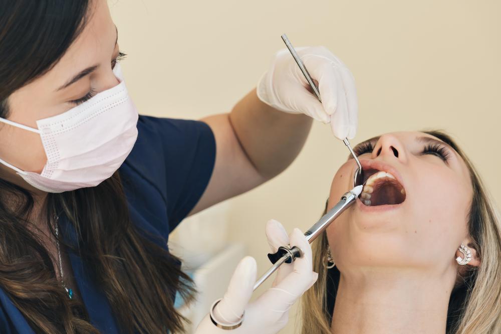 Dentist administering anesthesia for emergency dental care