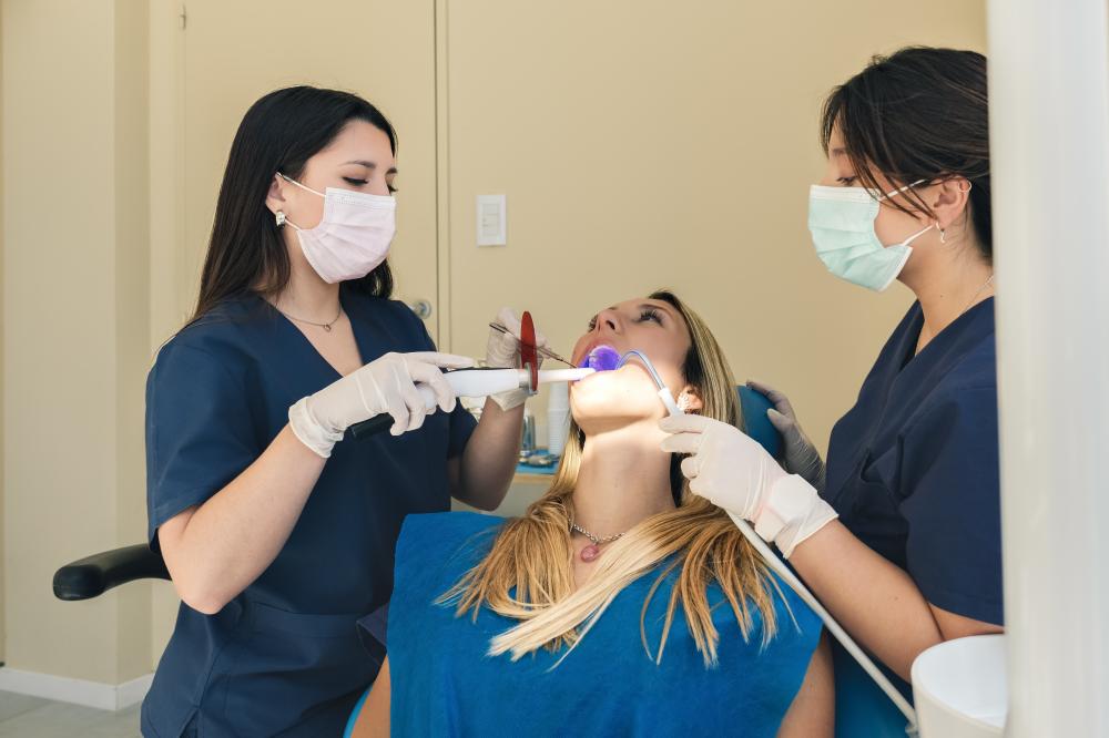 Dentist and assistant performing a procedure during weekend dental care