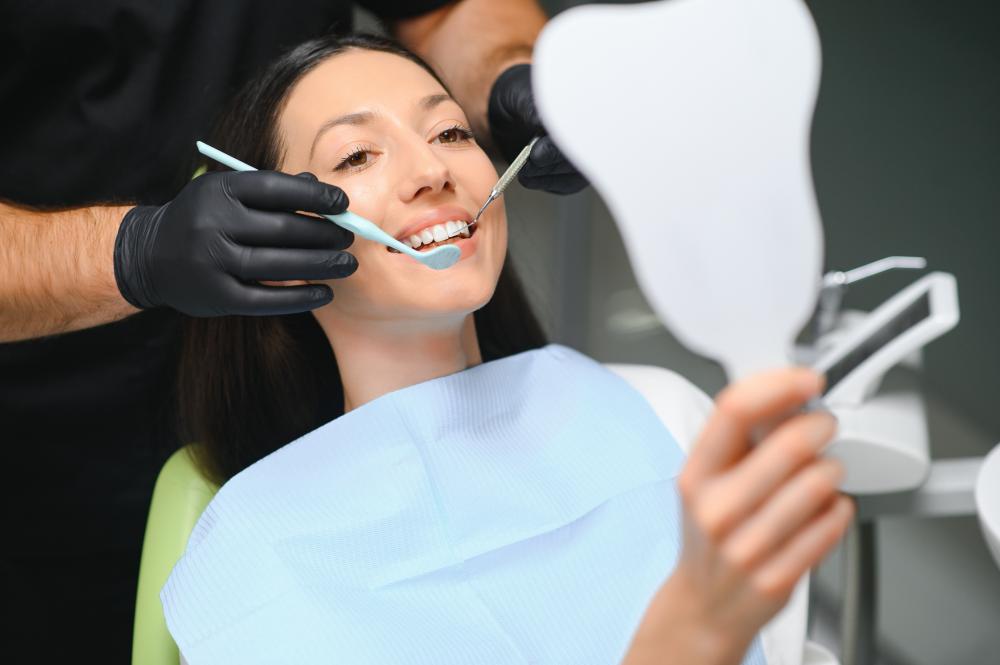 Dentist examining a patient's teeth at Evershine Dental Care