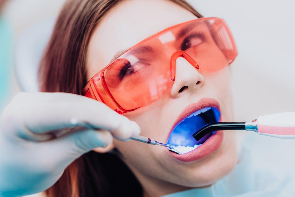 Orthodontist examining patient highlighting expertise in periodontics