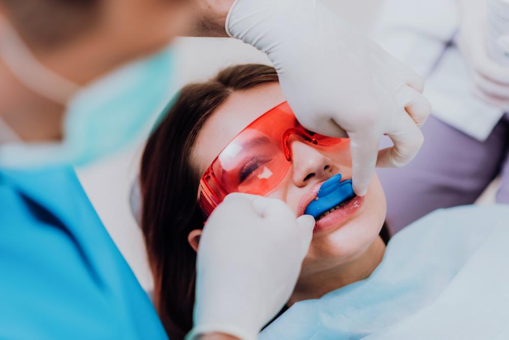Orthodontist carrying out a professional teeth cleaning procedure