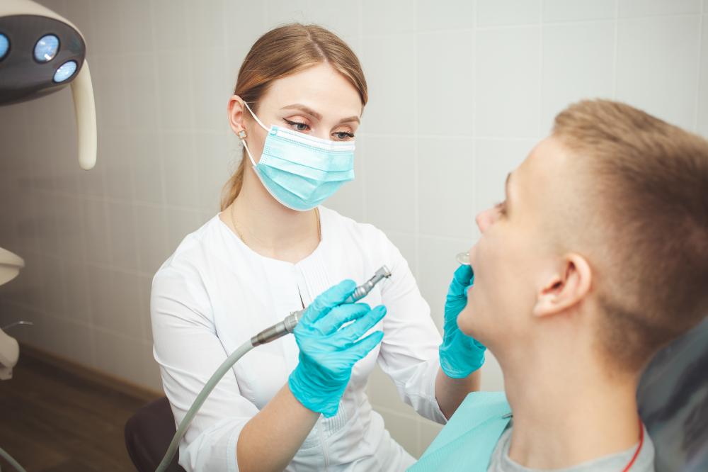 European female dentist ready for cosmetic dental service
