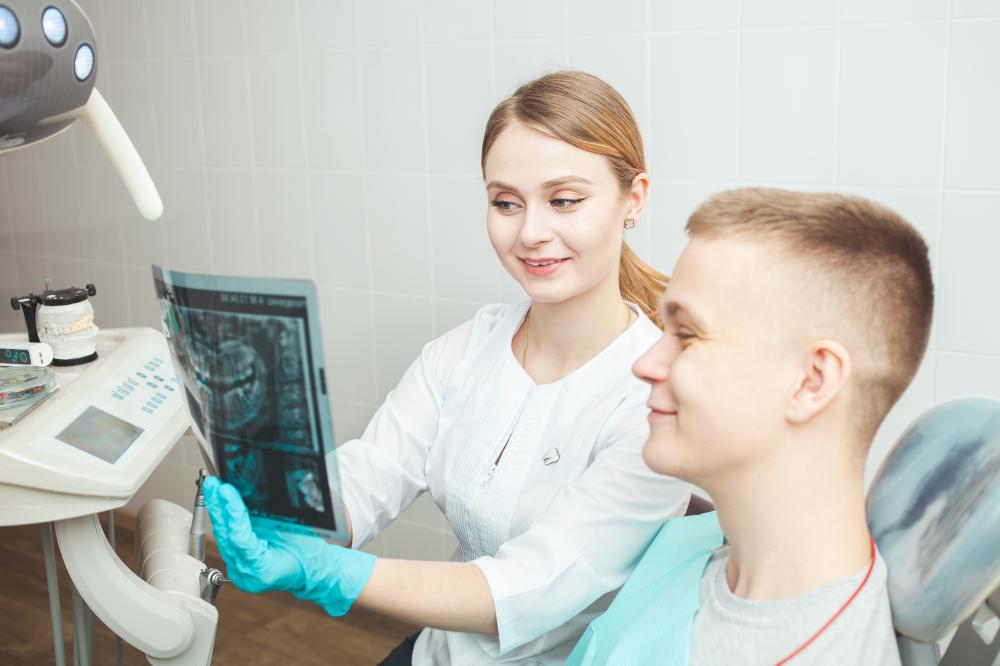 Dentist and patient discussing dental care