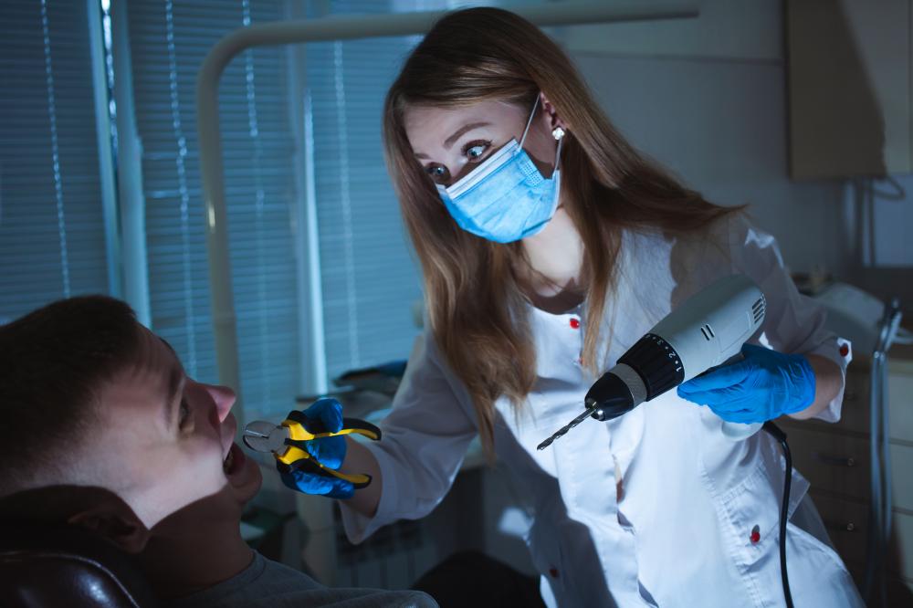 Compassionate dentist providing patient care during extraction