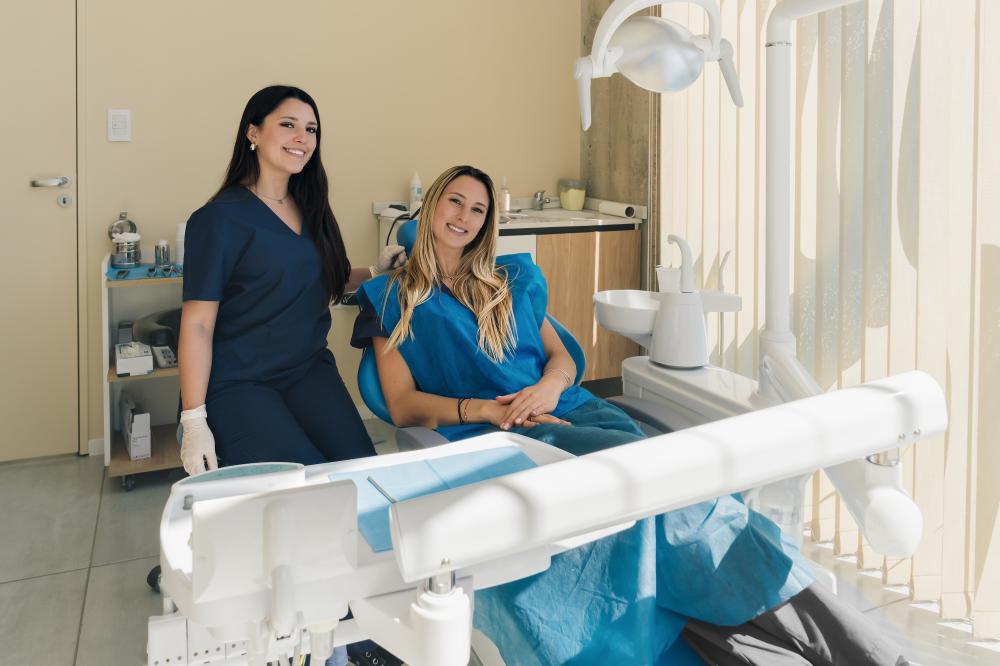 Latin young dentist with blonde patient at Smiles of Winter Haven