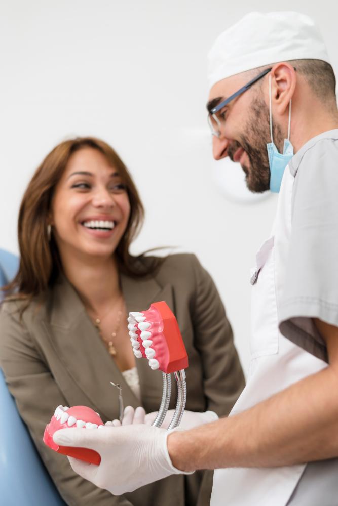 Dentist explaining dental implants to patient in Houston