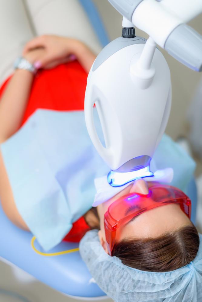 Patient receiving professional teeth whitening treatment