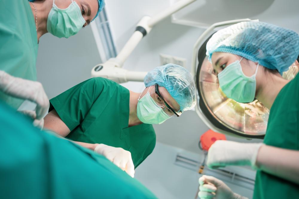 Surgeon in scrubs preparing for rectal prolapse surgery