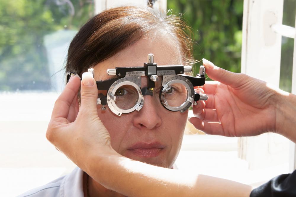 Optical expert providing professional eye patch fitting