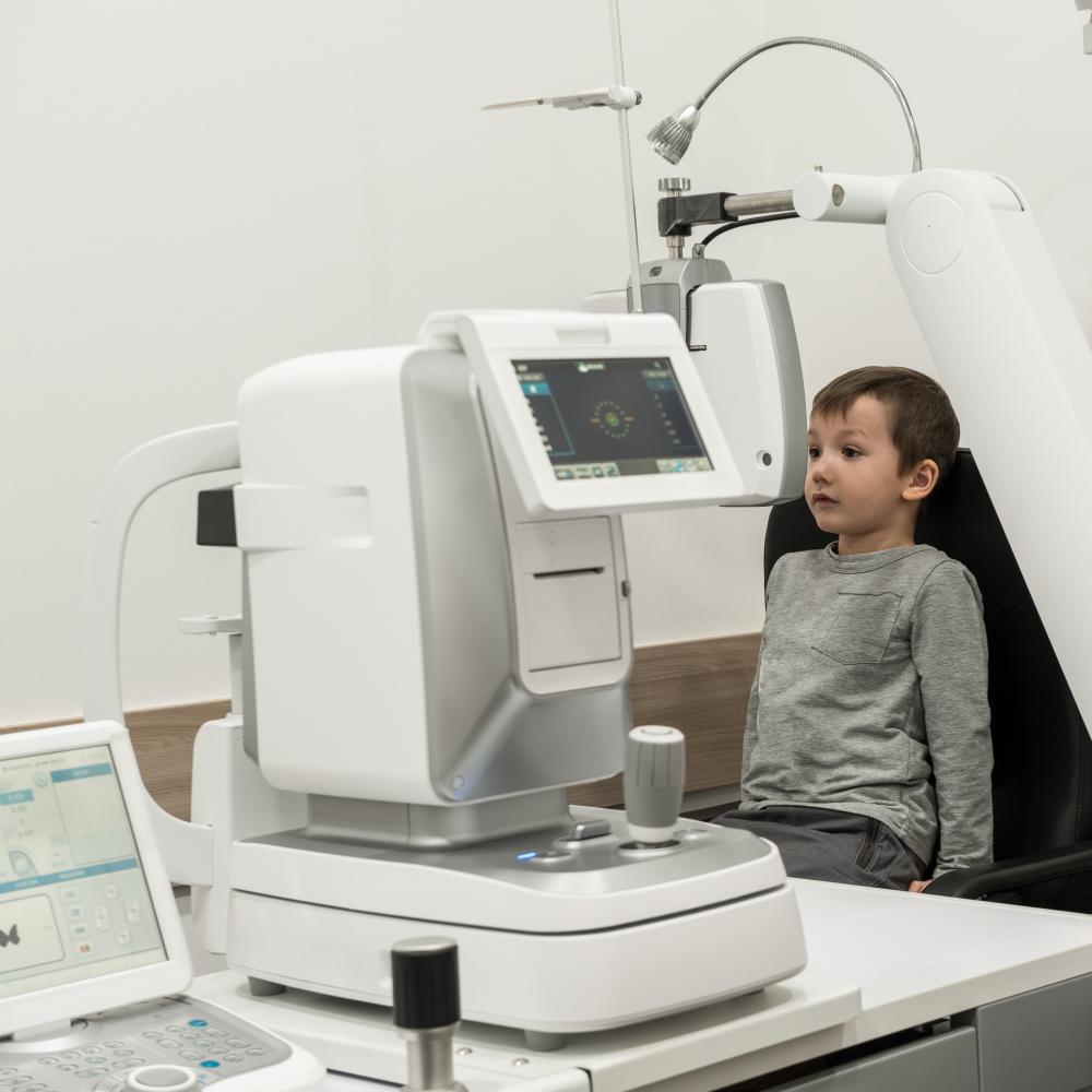 Optometrist explaining amblyopia treatment to concerned parent