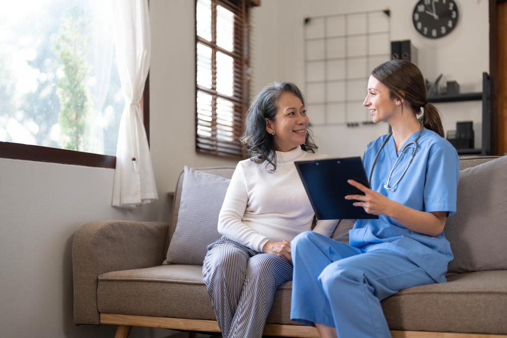 Home health aide offering compassionate care to a patient