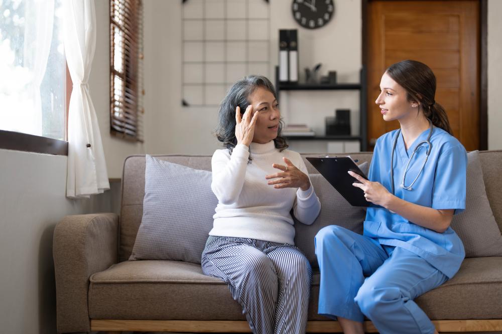 Compassionate home care nurse with elderly patient in NYC