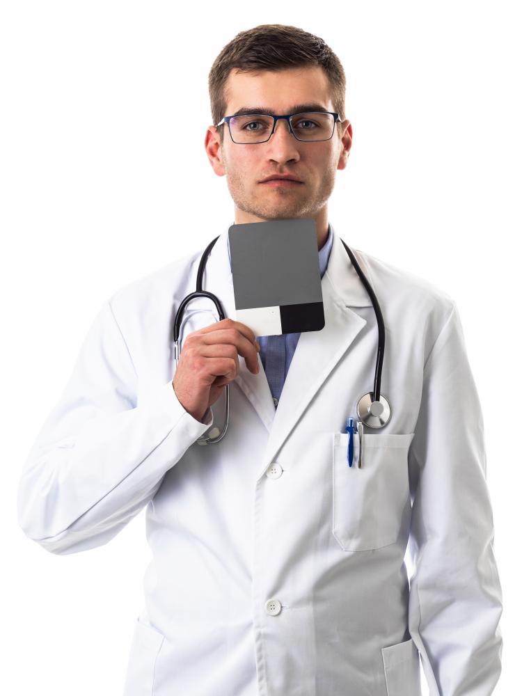Confident male doctor with stethoscope and white lab coat