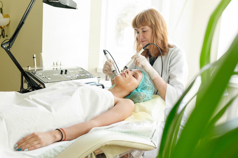 Cosmetologist performing advanced microcurrent therapy at Lifepath MedSpa